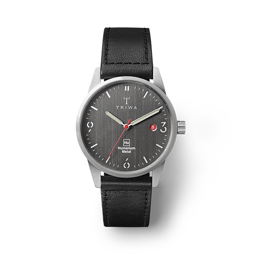 Humanium metal watch by Triwa, black quadrant and black leather strap sold at UNDP Shop
